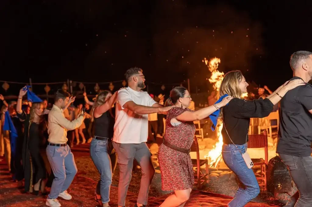 tourist in a camp in morocco near fire