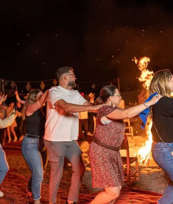 tourist in a camp in morocco near fire